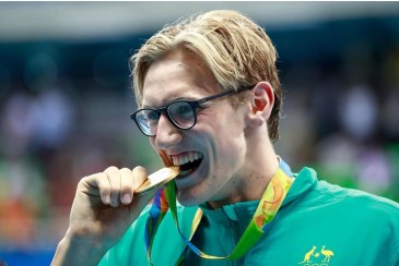 thumbnail_Obligatory bite the medal photo